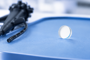Endoscope light guide lens on a blue inspection surface